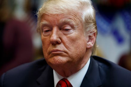 President Donald Trump pauses as he speaks with astronauts Jessica Meir and Christina Koch as they c...