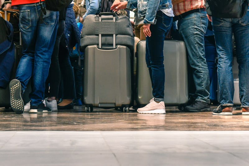 Passengers waiting in line for boarding an airport for a flight. Ever wonder why waiting in line is so annoying?