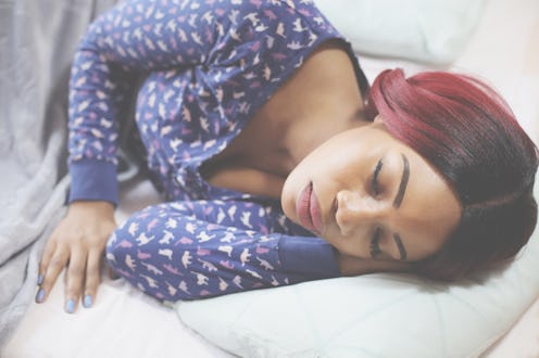African American woman sleeping in bed. Space for copy.