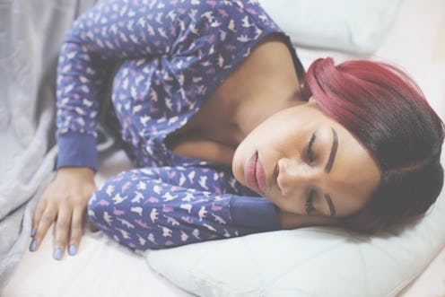 African American woman sleeping in bed. Space for copy.