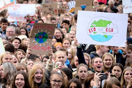 People attend a 'Fridays For Future' rally at the Brandenburg Gate in Berlin, Germany, . Protests of...