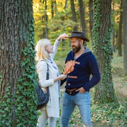 Young couple with autumnal mood. Passion dating and love. Autumn and leaf fall Dreams. Portrait of b...