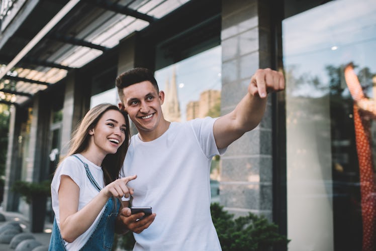 Caucasian carefree couple in love discussing something while enjoying date and flirt feelings, posit...