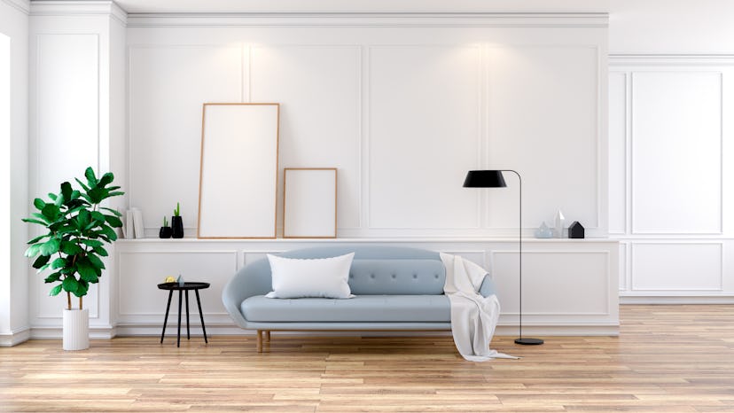 Modern mid Century room interior , Gray  sofa with mock-up on white wall and wood floor ,3d renderin...