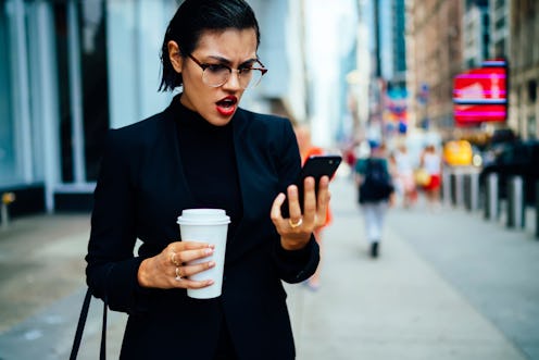 Angry woman in optical eyeglasses for vision correction with unhappy expression on face received ema...