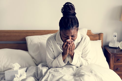 A sick woman in bed