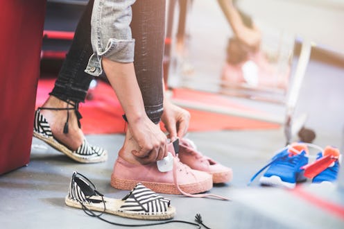 Woman trying shoes in store