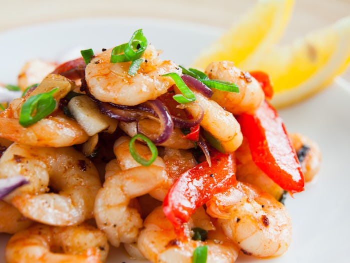 shrimp, peppers and onions on a plate