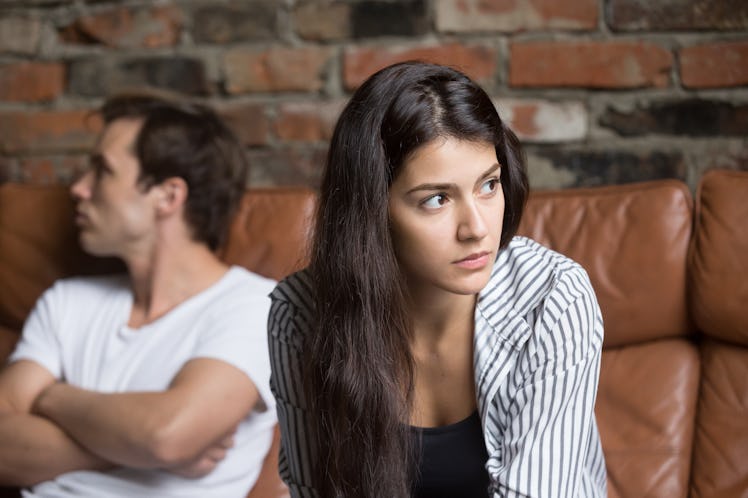 Angry unhappy young couple ignoring not looking at each other after family fight or quarrel, upset t...