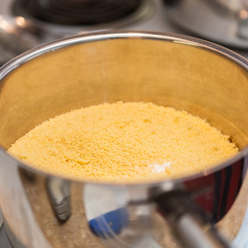 Macro Closeup of Organic Whole Wheat Couscous Cooking in a Pot