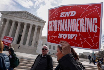 Protesters rally outside as Justices hear arguments in Benisek v. Lamone, the Maryland Gerrymanderin...
