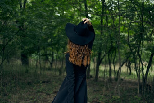 woman in a forest grove resting in nature