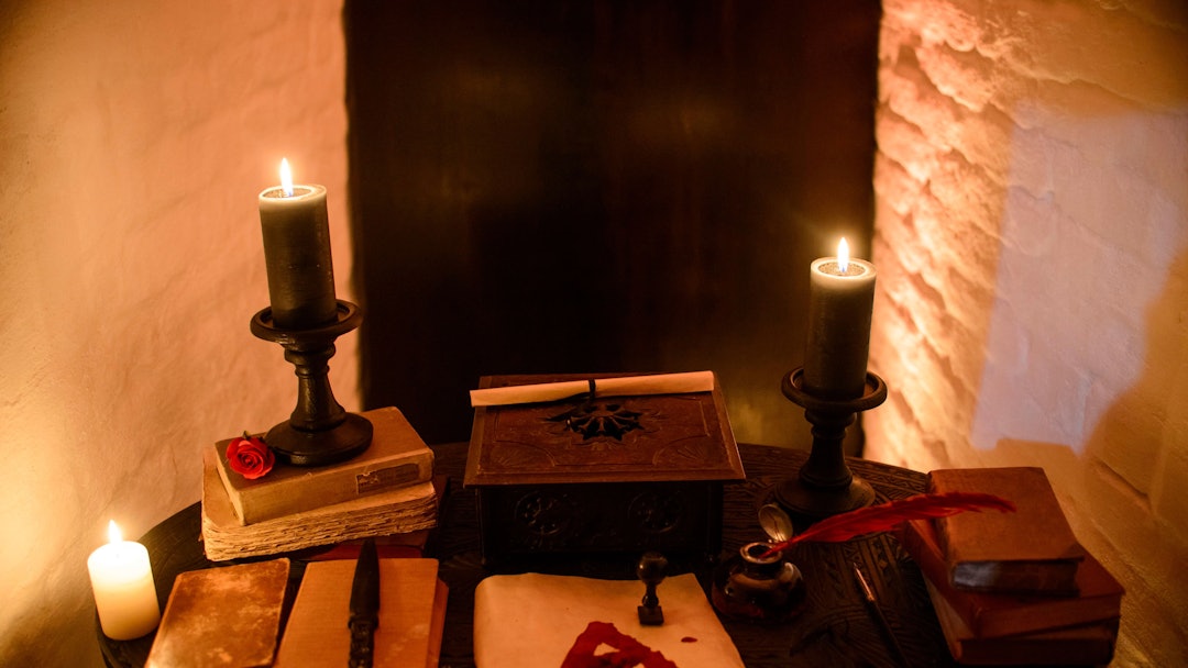 In this picture taken, candles and books are arranged on a table before a photo shoot of a room in B...