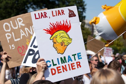 A sign depicts US President Donald J. Trump during the DC Climate Strike March, on the West Front of...