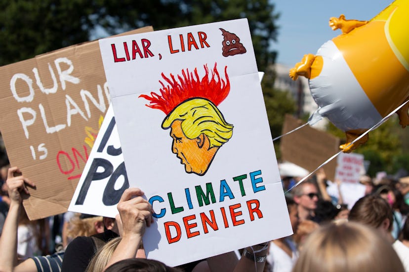 A sign depicts US President Donald J. Trump during the DC Climate Strike March, on the West Front of...