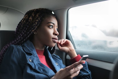 Black girl thinking on the backseat