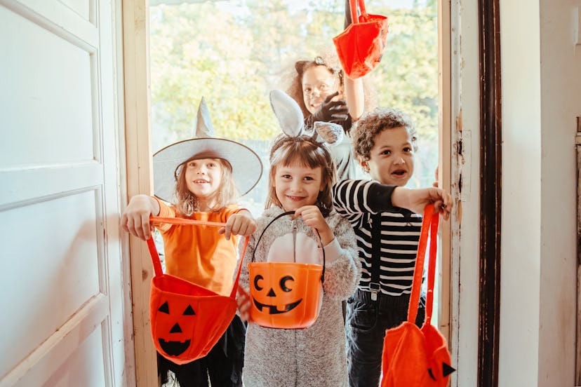 Children in Halloween costumes, trick or treating 