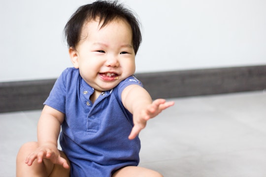 Reaching developmental milestones could be the reason your baby is waving at nothing.