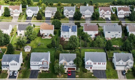 An aerial photo taken with a drone shows solar panels installed on a private home (C) in Round Lake ...