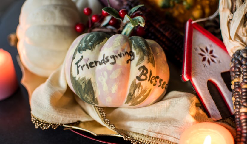 A pumpkin with friendsgiving written on it