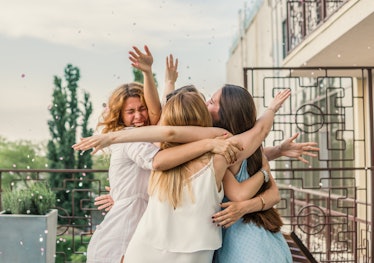 Girls Party. Beautiful Women Friendship on the balcony or roof At Bachelorette Party during sunset. ...