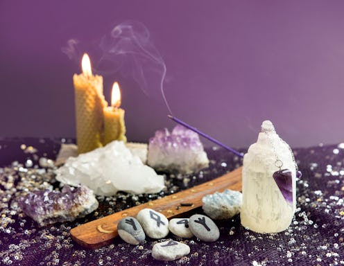 Set of many different psychic things on black background. Amethyst crystal pendulum, hand made rune ...