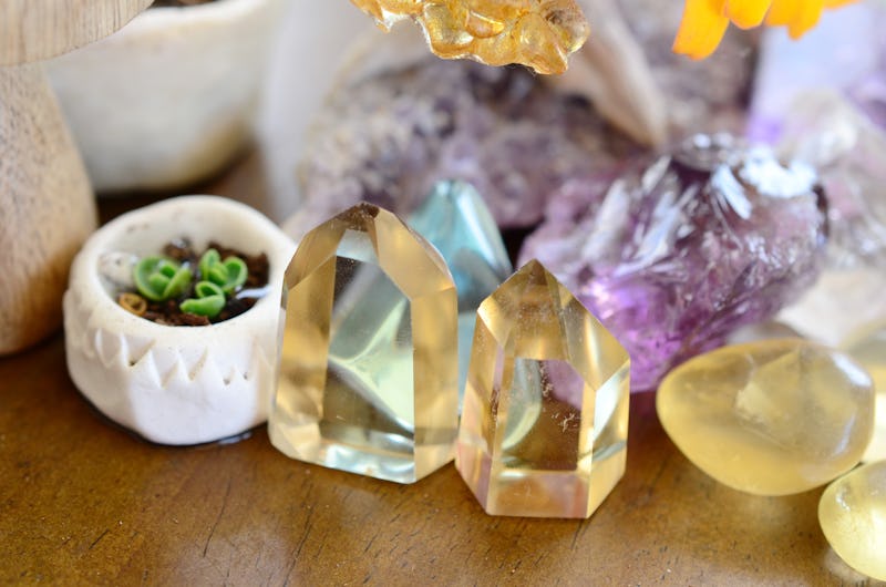 Mother of Thousands pups, baby plantlets in handmade ceramic pot. Miniature terrarium decoration with a collection of healing crystals. Aqua, Ametrine, Clear Quartz, and Fluorite. Beautiful colors