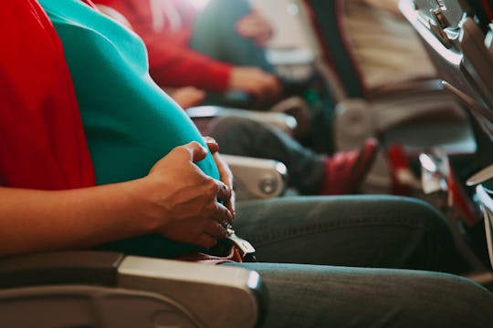 pregnant woman travel by plane