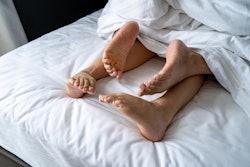 Foot man and girl be tired on the bed, couple bed story