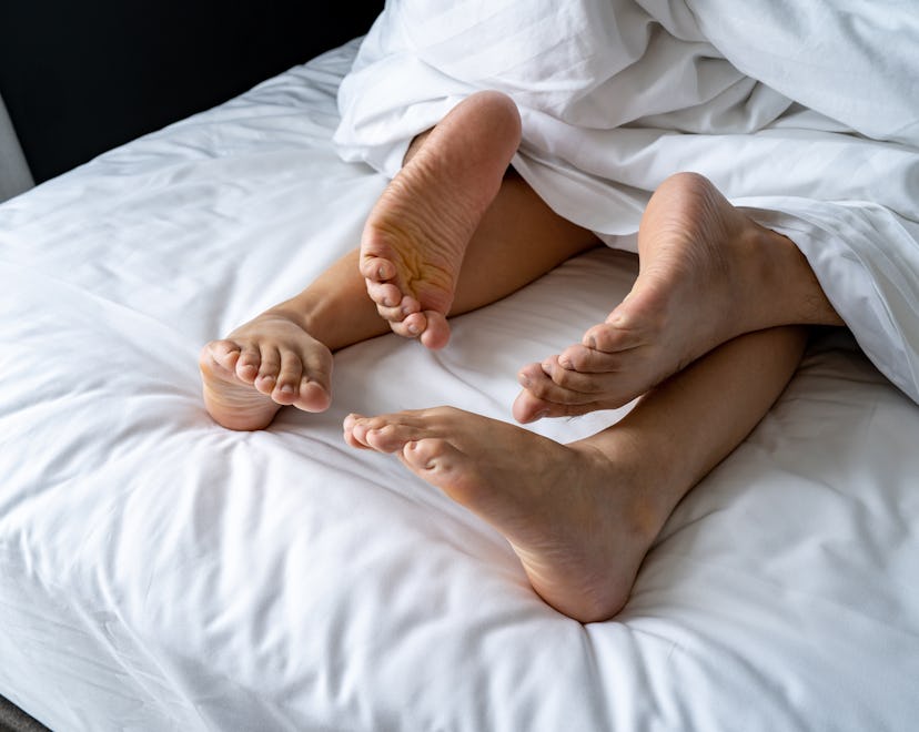 Foot man and girl be tired on the bed, couple bed story