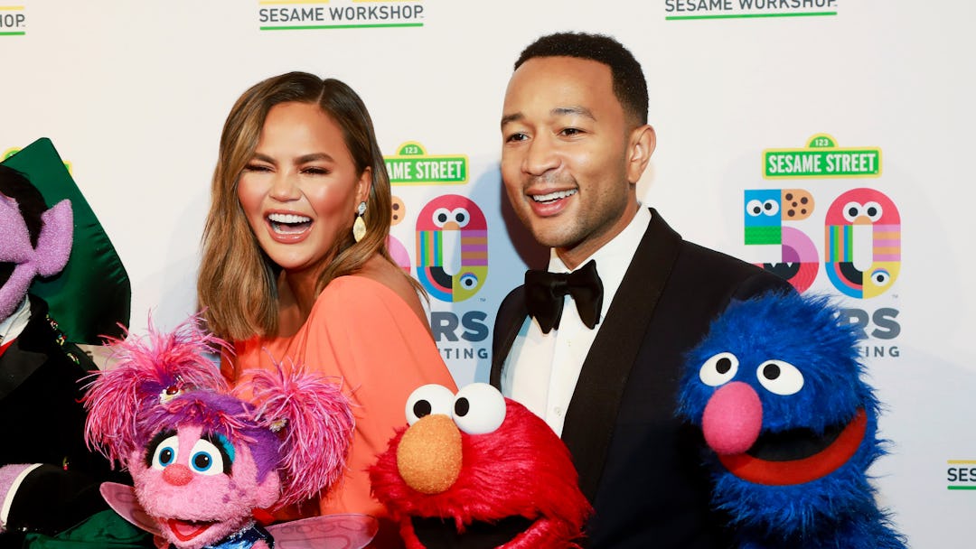 Chrissy Teigen, John Legend. Chrissy Teigen, left, and John Legend, right, attend the Sesame Worksho...