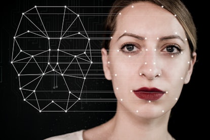 Biometric verification of a young woman with face tracking technology.
