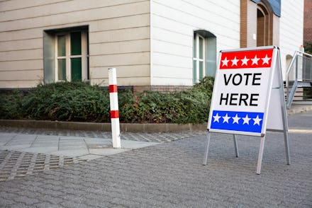 Polling Place Vote Here Sign On White Board Near House