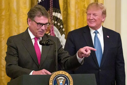 Donald Trump, Rick Perry. Energy Secretary Rick Perry, left, speaks as President Donald Trump smiles...