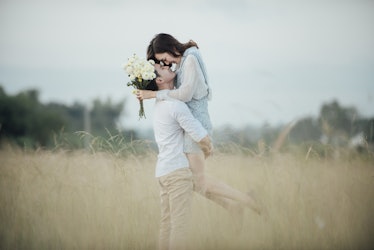 happy young couple in romance on a beautiful summer landscape
