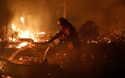 A marine works to put out a fire in the Chiquitania Forest in Santa Rosa de Tucabaca, on the outskir...