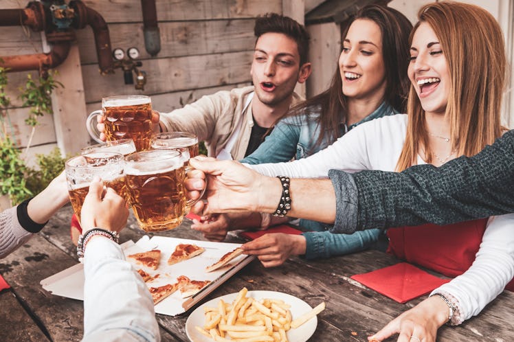 A picture of a group of friends clinking their beer glasses is meant for any of these clever brewery...