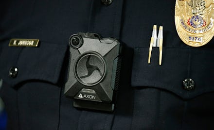 Phoenix Police Department Sgt. Kevin Johnson shows off the new Axon Body 2 body camera as another pr...