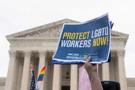 Human Rights Campaign supporter takes part in a rally outside the Supreme Court during oral argument...