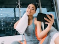 Young woman taking a selfie after a workout, in need of Instagram caption.