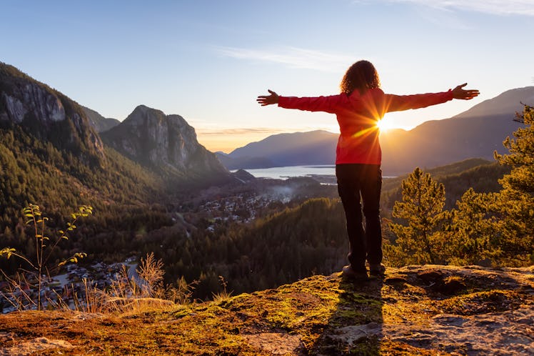 Adventurous Girl Hiking in the mountains during a sunny Autumn Sunset. Taken Squamish, North of Vanc...