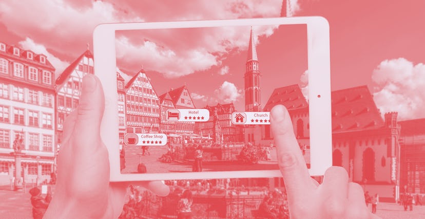 Hand holding smart phone use AR application to check relevant information about the spaces around cu...