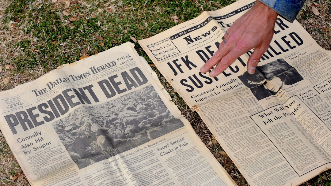 Gary Gossett Shows Two Local Newspapers His Mother Saved From the Day at Dealey Plaza the Site of th...