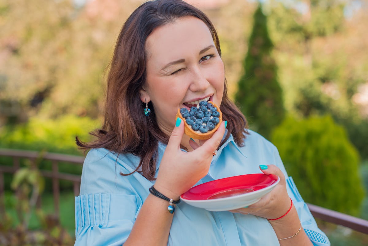 Morning of plus size woman, lady eat sweets and drink coffee