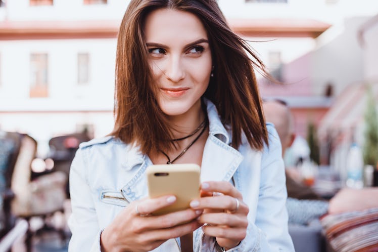 young pretty woman posing in the street with phone, outdoor portrait, hipster girls, sisters, chic, ...