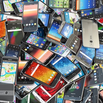 Choose mobile phone. Heap of the different smartphones with different application on the screen. Mod...