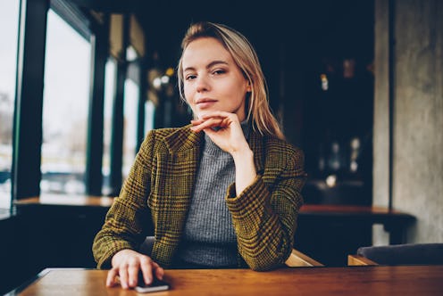 Half length portrait of confident businesswoman dressed in stylish jacket looking at camera.Serious ...