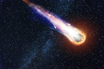 A comet, an asteroid, a meteorite falls to the ground against a starry sky. Attack of the meteorite....
