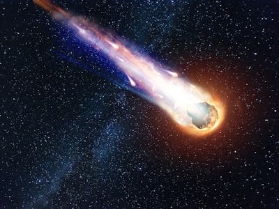 A comet, an asteroid, a meteorite falls to the ground against a starry sky. Attack of the meteorite....