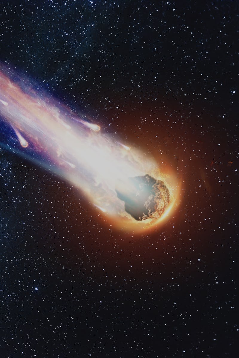 A comet, an asteroid, a meteorite falls to the ground against a starry sky. Attack of the meteorite....